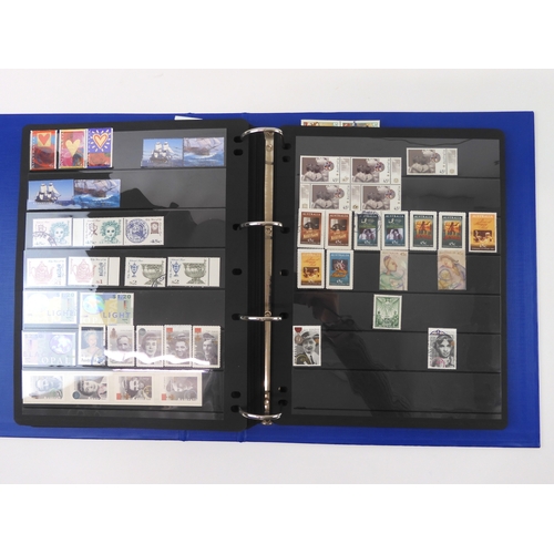 7021 - AUSTRALIA A collection of new and used stamps in three albums and a stock book to include booklets a... 