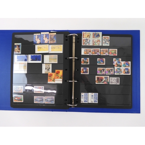 7021 - AUSTRALIA A collection of new and used stamps in three albums and a stock book to include booklets a... 