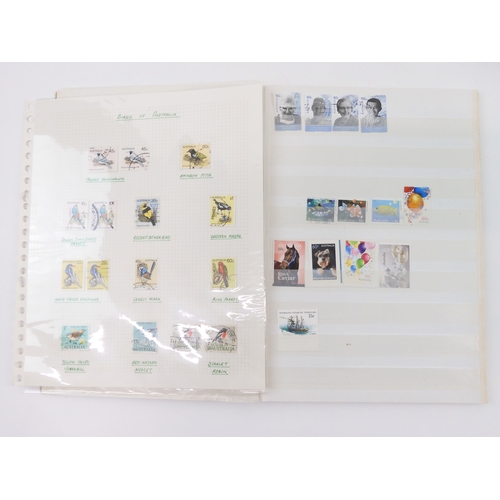 7021 - AUSTRALIA A collection of new and used stamps in three albums and a stock book to include booklets a... 