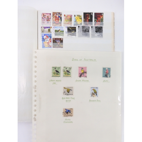 7021 - AUSTRALIA <br />A collection of new and used stamps in three albums and a stock book to include book...