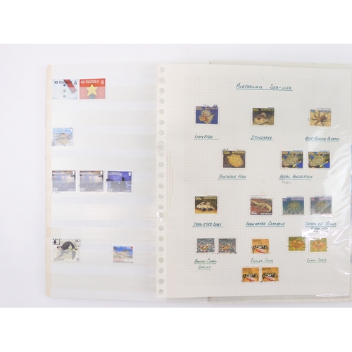 7021 - AUSTRALIA A collection of new and used stamps in three albums and a stock book to include booklets a... 