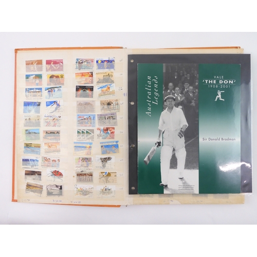 7021 - AUSTRALIA A collection of new and used stamps in three albums and a stock book to include booklets a... 