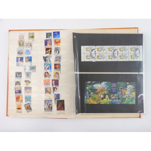 7021 - AUSTRALIA A collection of new and used stamps in three albums and a stock book to include booklets a... 