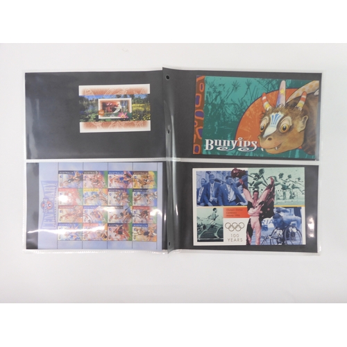 7021 - AUSTRALIA A collection of new and used stamps in three albums and a stock book to include booklets a... 