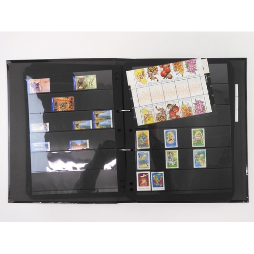 7021 - AUSTRALIA A collection of new and used stamps in three albums and a stock book to include booklets a... 