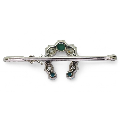 2773 - A LUCKY HORSE SHOE BROOCHmade in 9ct white gold and set with turquoise and old cut diamonds with an ... 