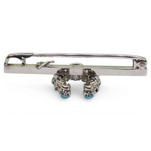 2773 - A LUCKY HORSE SHOE BROOCHmade in 9ct white gold and set with turquoise and old cut diamonds with an ... 