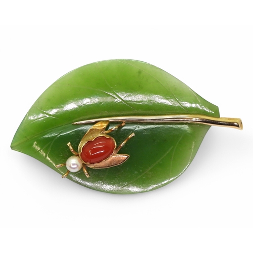 2781 - A HARDSTONE LEAF BROOCHmade from finely carved green hardstone, mounted in 14k gold, with a coral an... 