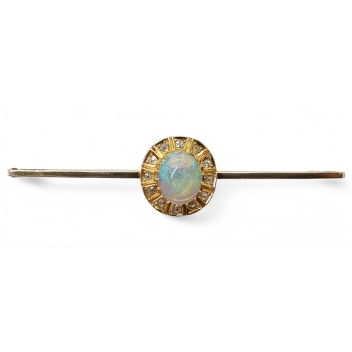 2785 - A BLACK OPAL BROOCHset with a 9mm x 7.5mm x 3.9mm cabochon opal, surrounded with old cut diamonds. L... 