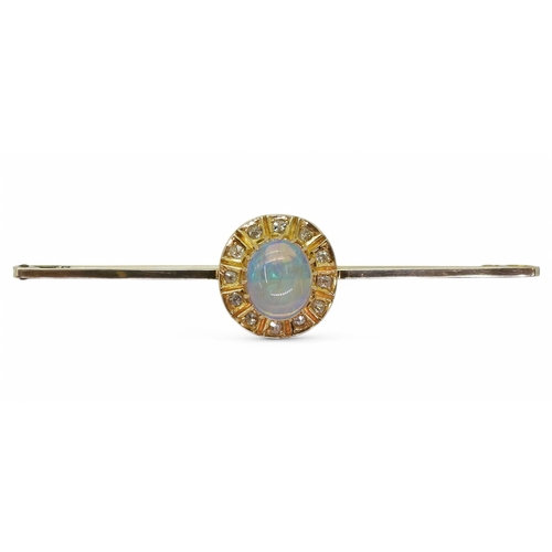 2785 - A BLACK OPAL BROOCHset with a 9mm x 7.5mm x 3.9mm cabochon opal, surrounded with old cut diamonds. L... 