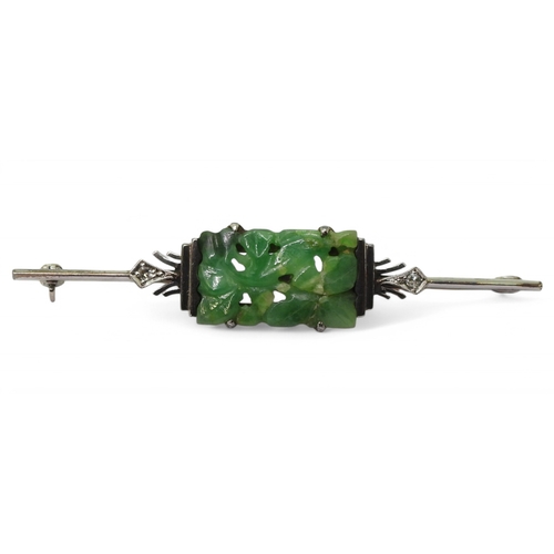 2786 - AN ART DECO BROOCHmade in 14k white gold and platinum, set with a Chinese green hardstone carve... 