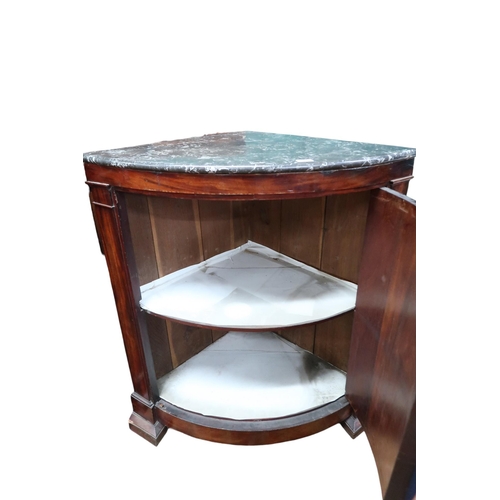 3 - A pair of late Victorian marble topped mahogany corner cabinets with single bow fronted doors on bra... 