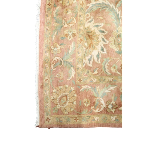 5 - A pink ground Aubusson style rug with green floral/foliate patterned ground within floral/foliate bo... 