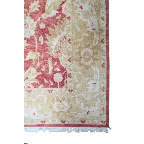 54 - A terracotta ground Zeigler style rug with cream floral patterned ground with floral border, 245cm l... 