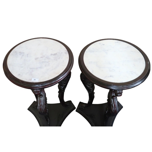 56 - A pair of 20th century circular marble inset jardiniere stands on serpentine carved supports joined ... 