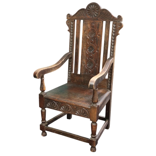 6 - A 19th century oak Wainscot style armchair with carved backrest over down swept arms flanking plain ... 