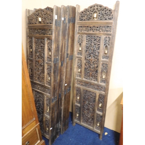 71 - A four assorted contemporary stained teak ethnic room dividers with pierced fret cut panels, each pa... 