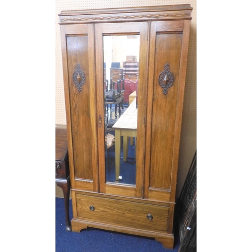 72 - An early 20th century oak mirror doored wardrobe, 190cm high x 84cm wide x 46cm deep