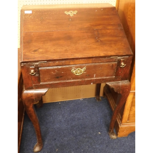 73 - A 19th century oak writing bureau with fall front writing compartment over single drawer on ser... 