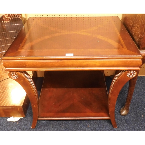 74 - A 20th century mahogany and walnut veneered lamp table on reeded bowed supports joined by lower tier... 