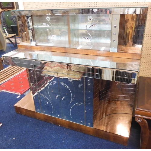 81 - An early 20th century Art Deco mirrored drinks cabinet with glazed sliding door superstructure on ba... 