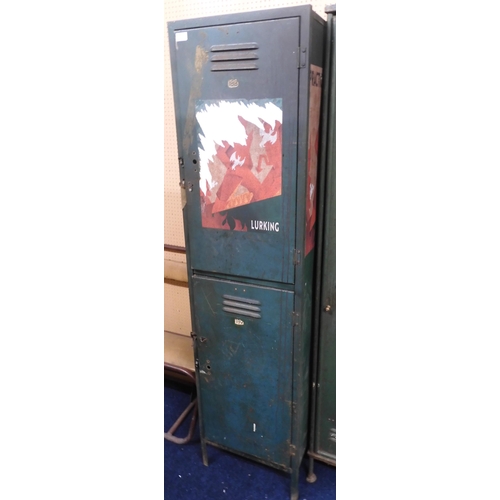 87 - A 20th century steel storage locker with two doors over painted with propaganda slogan 