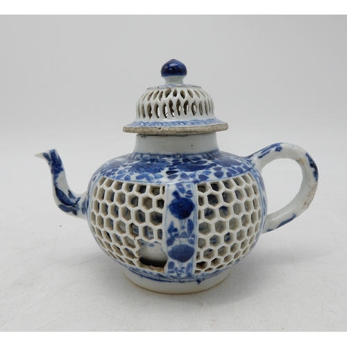 2274 - A CHINESE BLUE AND WHITE RETICULATED TEAPOTPainted with flowers,Kangxi,14.5cm high,Yixing miniature ... 