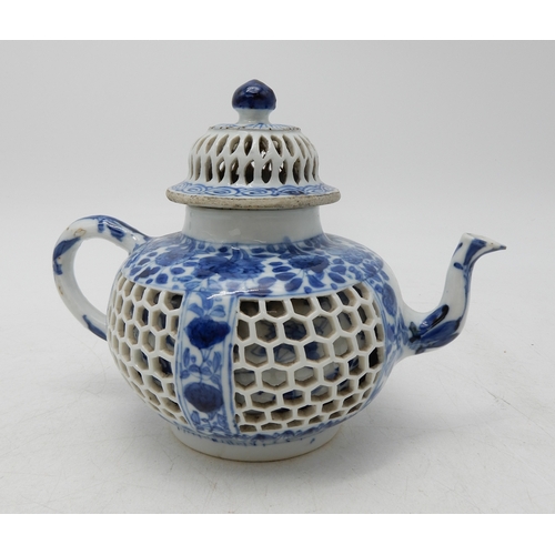 2274 - A CHINESE BLUE AND WHITE RETICULATED TEAPOTPainted with flowers,Kangxi,14.5cm high,Yixing miniature ... 