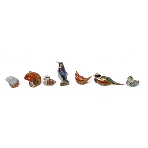 209 - A collection of Royal Crown Derby paperweights including Emperor Penguin, red squirrel, American Car... 