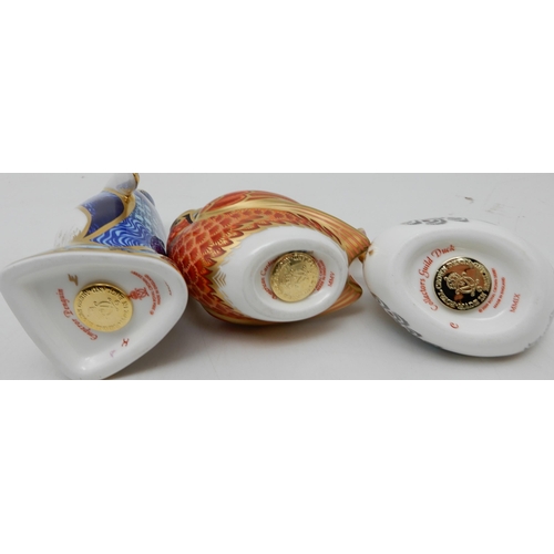 209 - A collection of Royal Crown Derby paperweights including Emperor Penguin, red squirrel, American Car... 