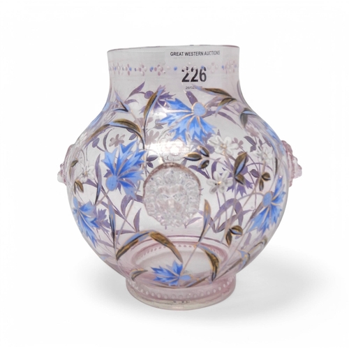 226 - A Fritz Heckert enamelled lilac glass vase, painted with cornflowers, with four applied lions head r... 