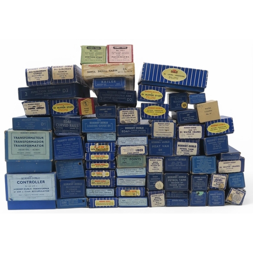 597 - A large quantity of boxed Hornby Dublo 00-gauge model railway components, including an Electric Trai... 