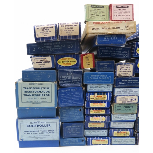 597 - A large quantity of boxed Hornby Dublo 00-gauge model railway components, including an Electric Trai... 