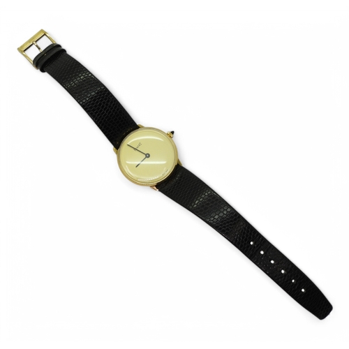 2870 - A PIAGET WATCH in 18k gold electroplate, the gold coloured plain dial, with black baton hands, ... 