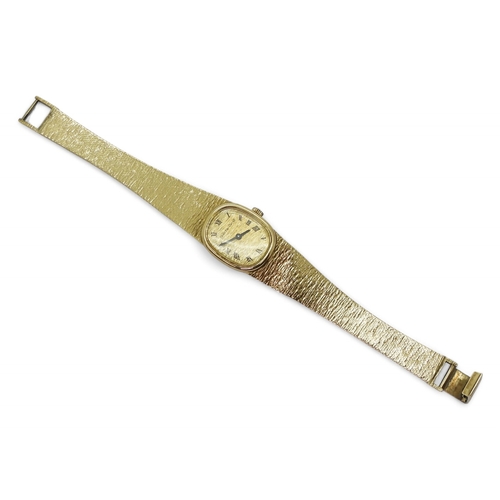 2887 - A LADIES BUECHE - GIRODin 9ct gold with integral bark textured strap, hallmarked London 1974. Gold b... 