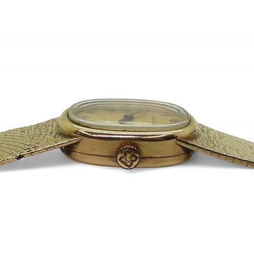 2887 - A LADIES BUECHE - GIRODin 9ct gold with integral bark textured strap, hallmarked London 1974. Gold b... 