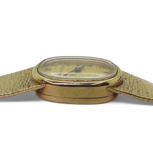 2887 - A LADIES BUECHE - GIRODin 9ct gold with integral bark textured strap, hallmarked London 1974. Gold b... 