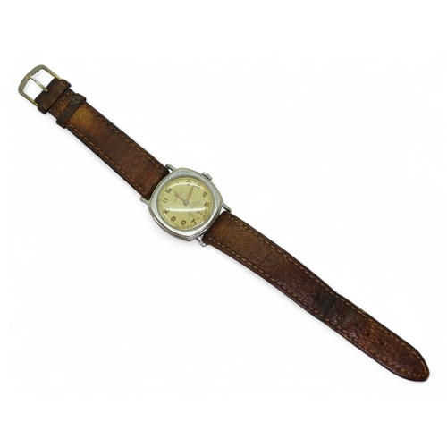 2896 - A VINTAGE ROLEXthe watch has a yellowed dial with gold coloured Arabic numerals and hands, with a su... 