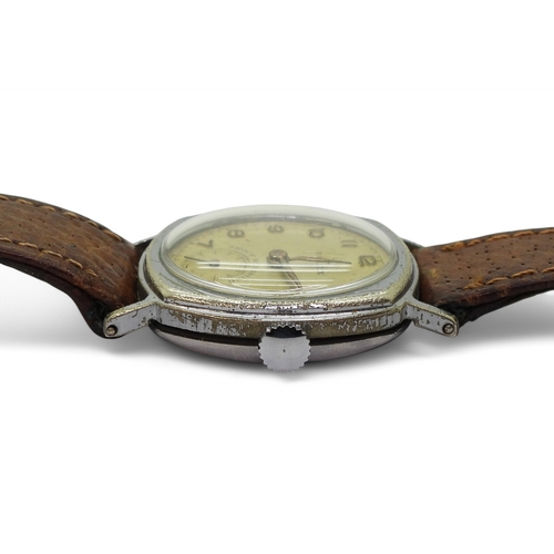 2896 - A VINTAGE ROLEXthe watch has a yellowed dial with gold coloured Arabic numerals and hands, with a su... 