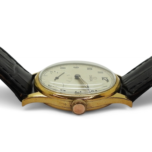 2898 - A 9CT GOLD OMEGAwith a silvered dial, black Arabic numerals, subsidiary seconds dial, with blued and... 