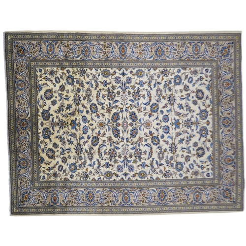 2123 - AN IVORY GROUND KESHAN FINE PILE WOOL RUG with all over floral/foliate design within multicolou... 