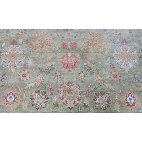 2128 - A IMPRESSIVE GREEN GROUND ZEIGLER RUGwith all over floral/foliate patterned ground within cream flor... 