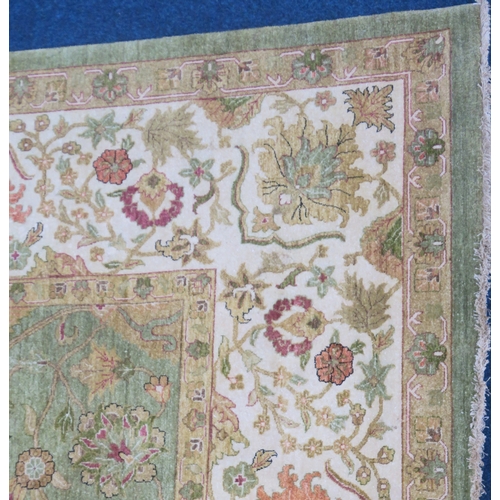 2128 - A IMPRESSIVE GREEN GROUND ZEIGLER RUGwith all over floral/foliate patterned ground within cream flor... 