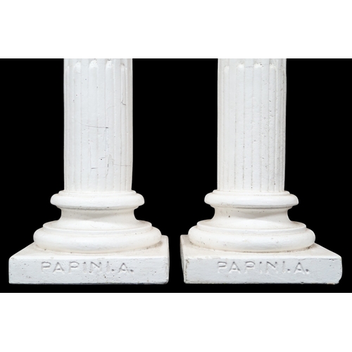 2056 - A PAIR OF EARLY 20TH CENTURY WHITE PAINTED STONEWARE PEDESTALSwith square tops on Corinthian style c... 