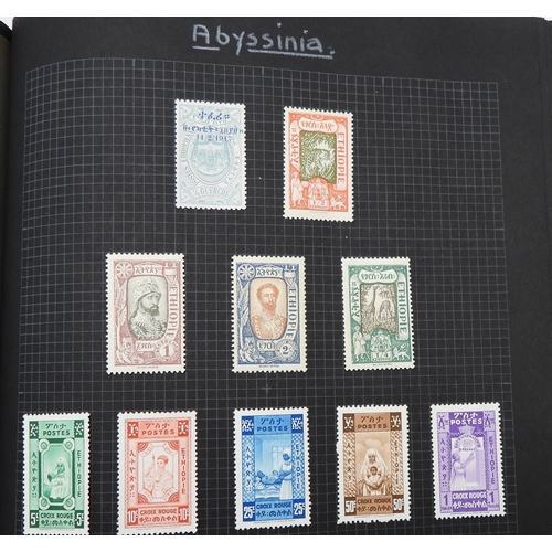 7043 - A collection of worldwide stamps in an album to include GB  1/d black four margin IC in corners used...