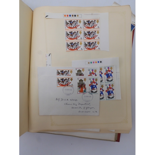 7045 - A worldwide stamp collection in four albums including 1 album of  GB with early phosphor sets, one a... 