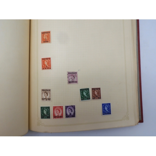 7045 - A worldwide stamp collection in four albums including 1 album of  GB with early phosphor sets, one a...