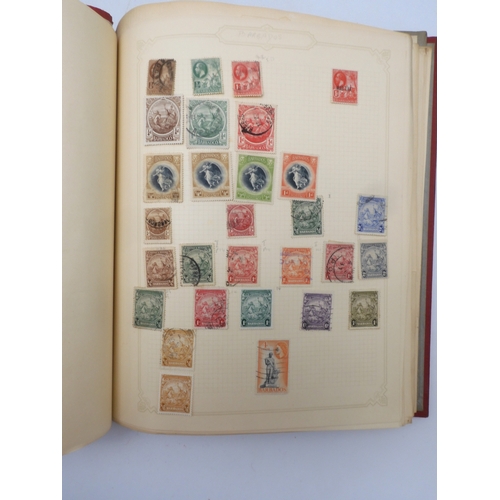 7045 - A worldwide stamp collection in four albums including 1 album of  GB with early phosphor sets, one a...