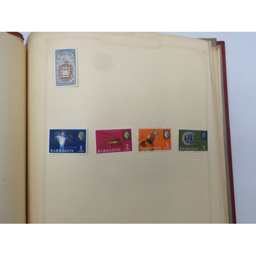 7045 - A worldwide stamp collection in four albums including 1 album of  GB with early phosphor sets, one a... 