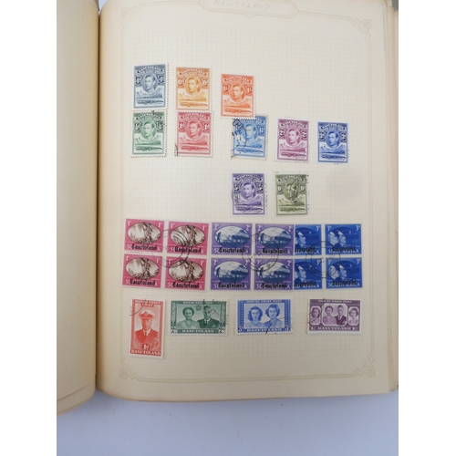 7045 - A worldwide stamp collection in four albums including 1 album of  GB with early phosphor sets, one a... 